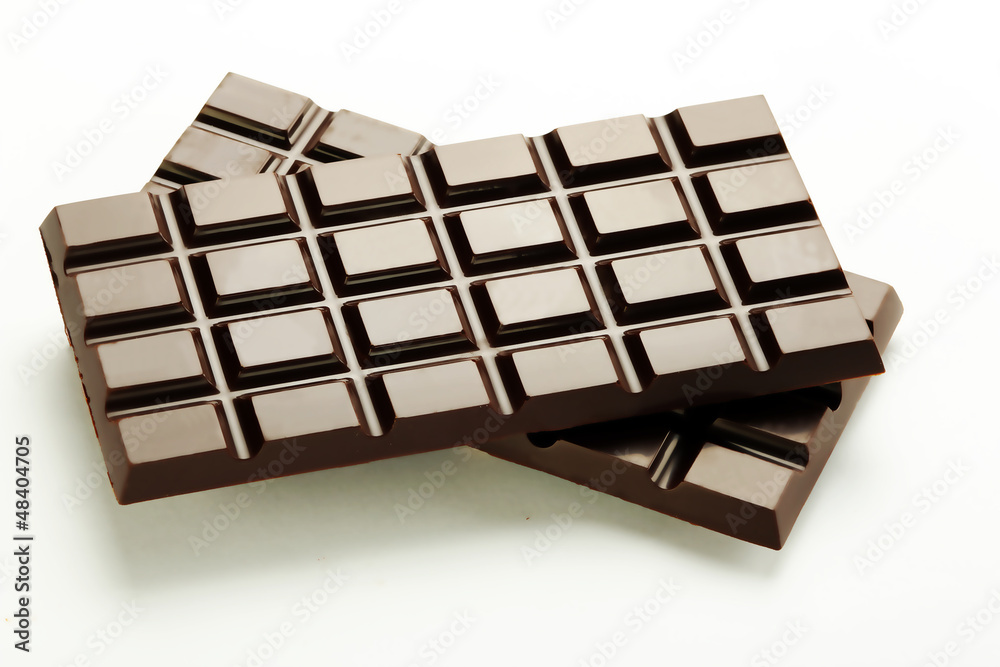 Dark chocolate plates on a white background Dark chocolate plates on a white background