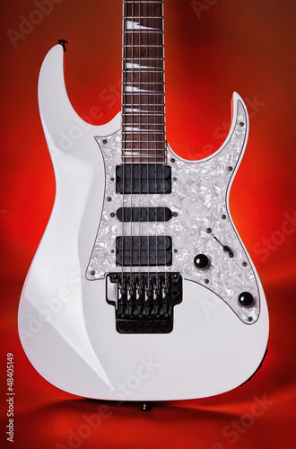 Electric guitar on red