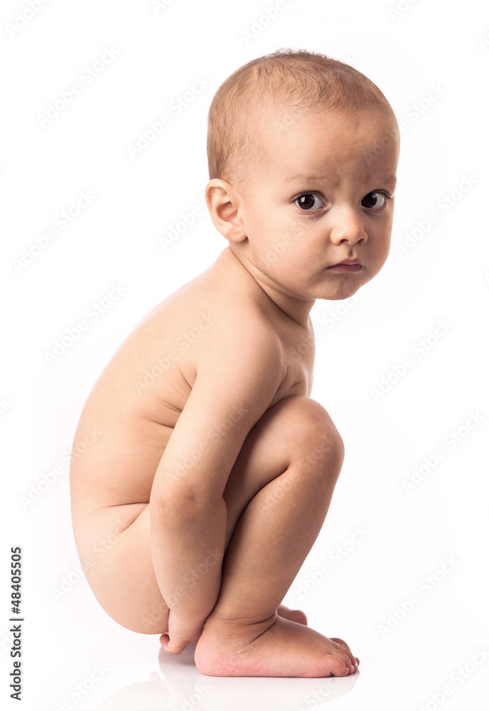 Cute little boy squatting over white background Cute little boy squatting over white background