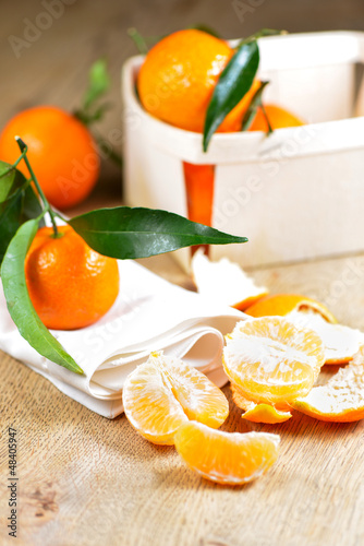 Pealed satsuma on wooden table