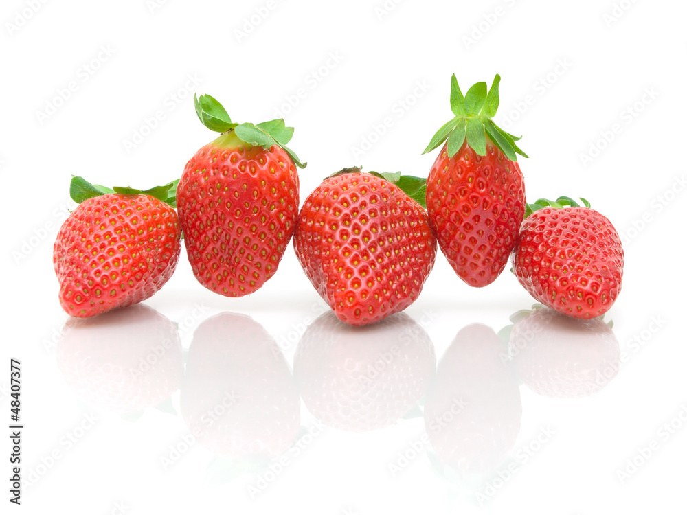 five strawberries on a white background close-up five strawberries on a white background close-up
