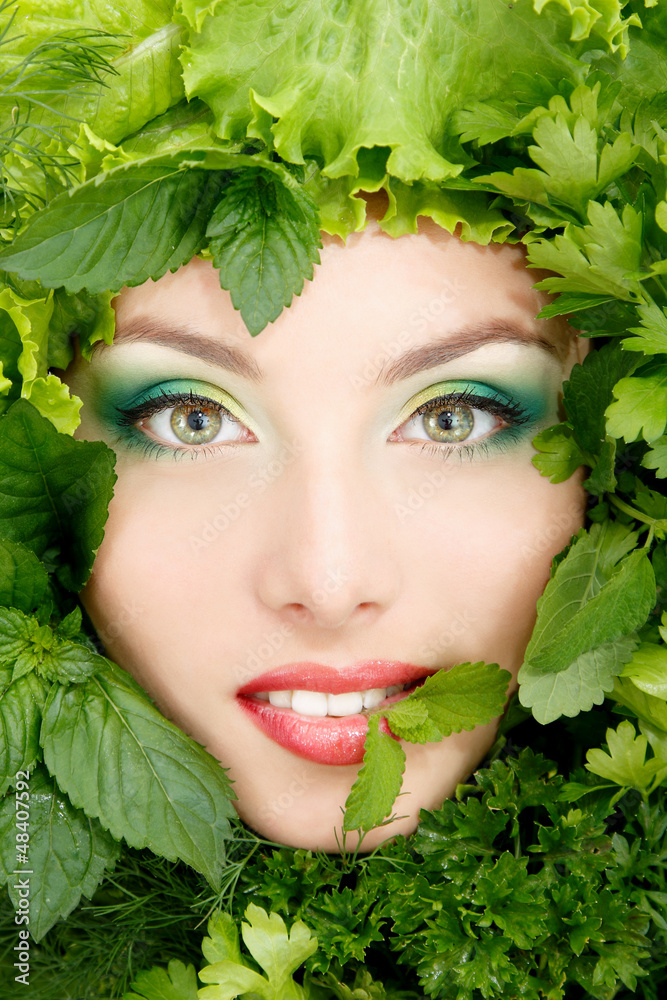 woman beauty face with greens vegetables frame woman beauty face with greens vegetables frame