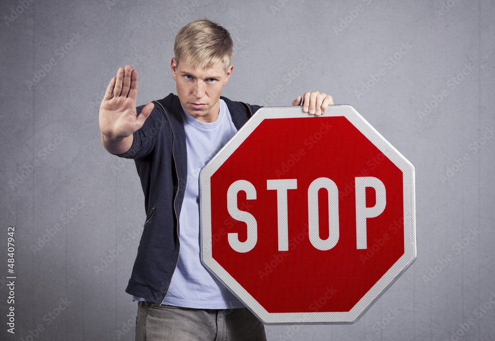 Man showing stop sign. Man showing stop sign.