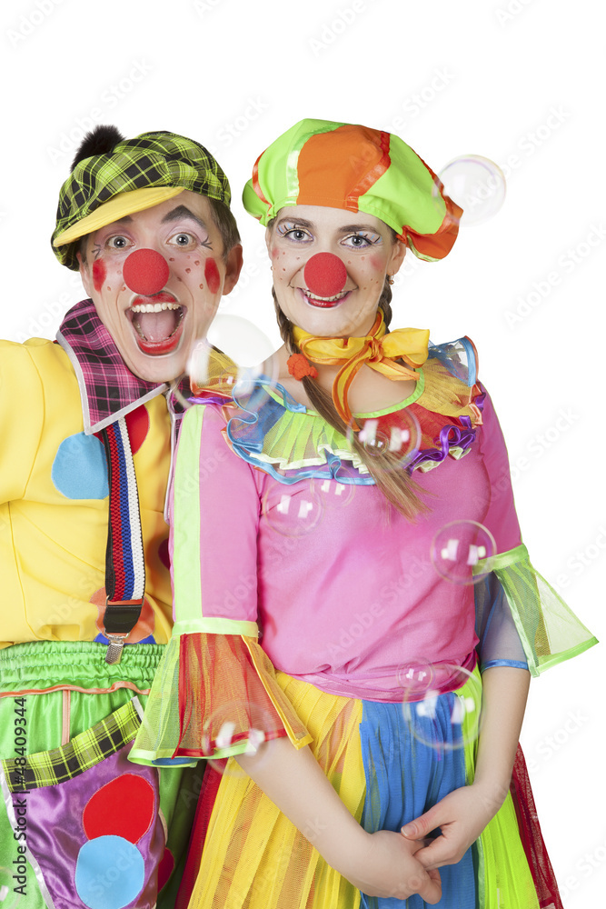 Two cheerful clowns in the soap bubbles