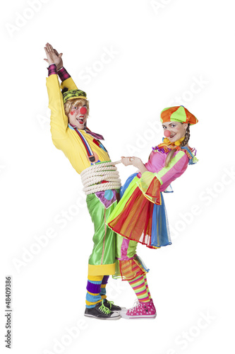 Two smiling clowns isolated over a white background