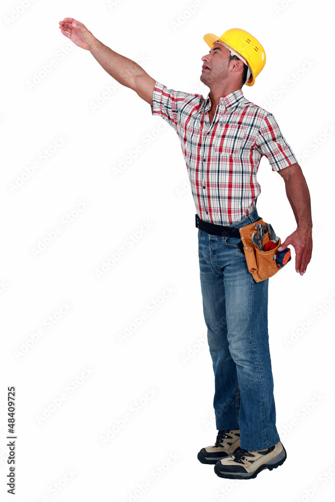 Construction worker reaching for something Construction worker reaching for something