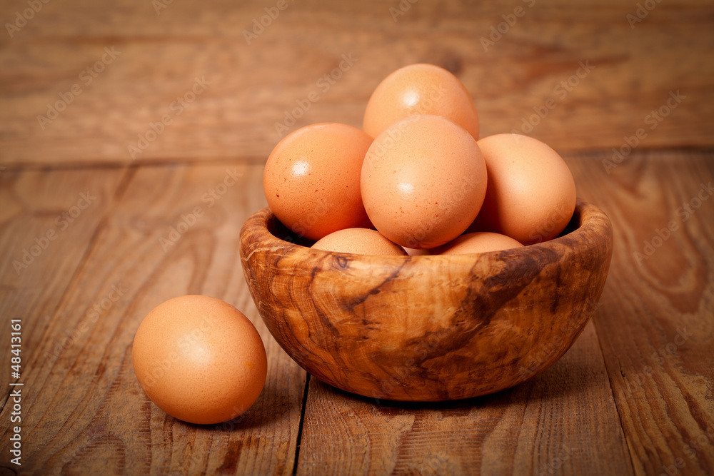 fresh brown eggs on wooden background fresh brown eggs on wooden background