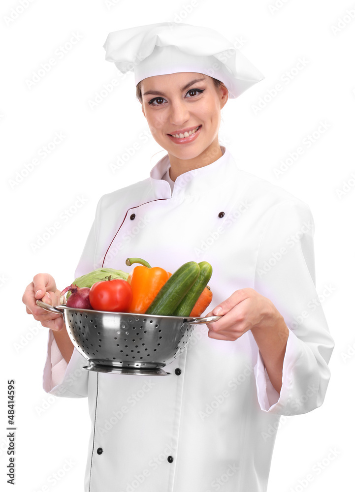 Portrait of young woman chef with vegetables isolated on white Portrait of young woman chef with vegetables isolated on white