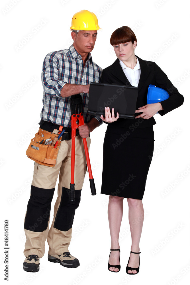 Architect and builder with a laptop Architect and builder with a laptop