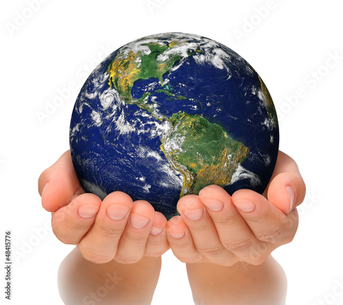 Woman holding globe on her hands, South and North America