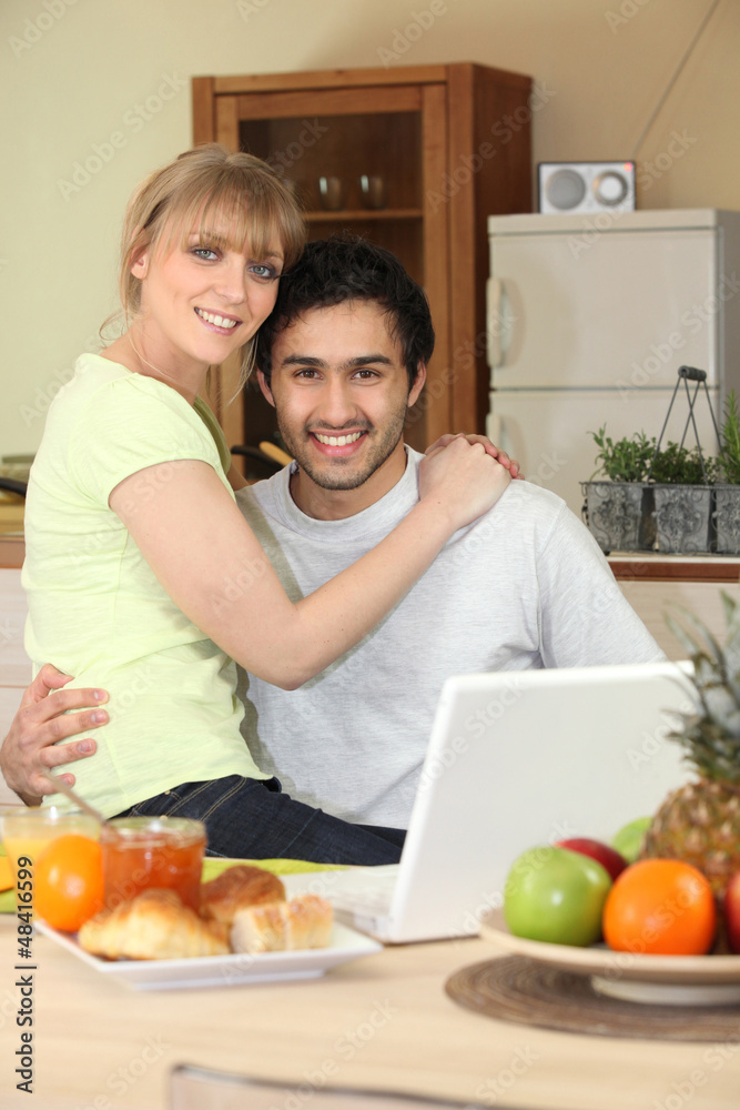 Affectionate young couple in the kitchen