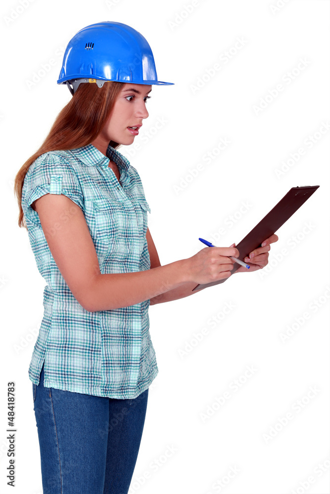 Shocked woman holding clipboard