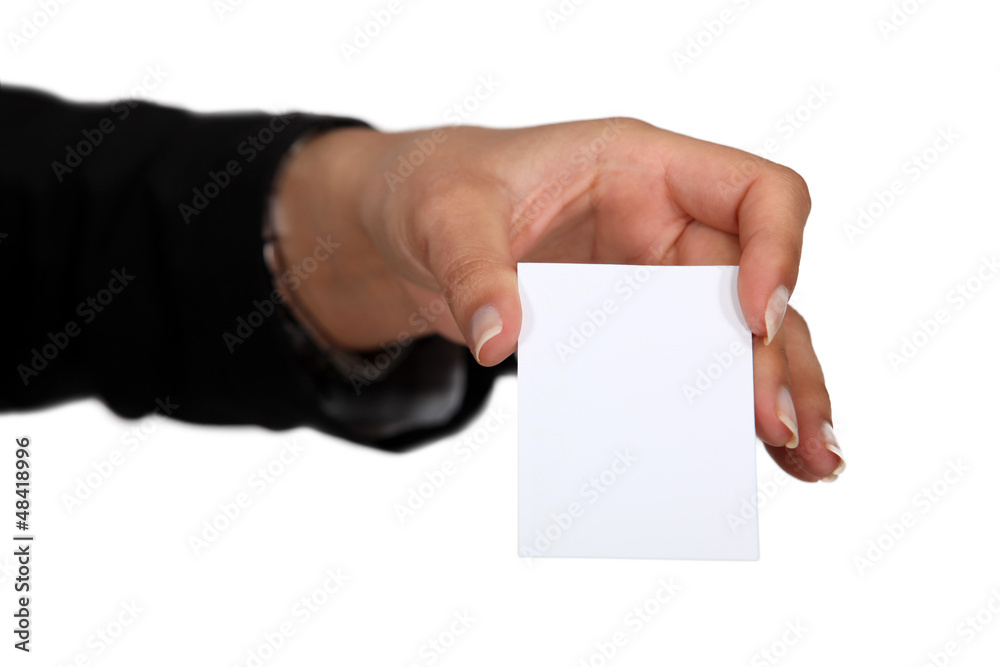Female hand holding a business card. Female hand holding a business card.