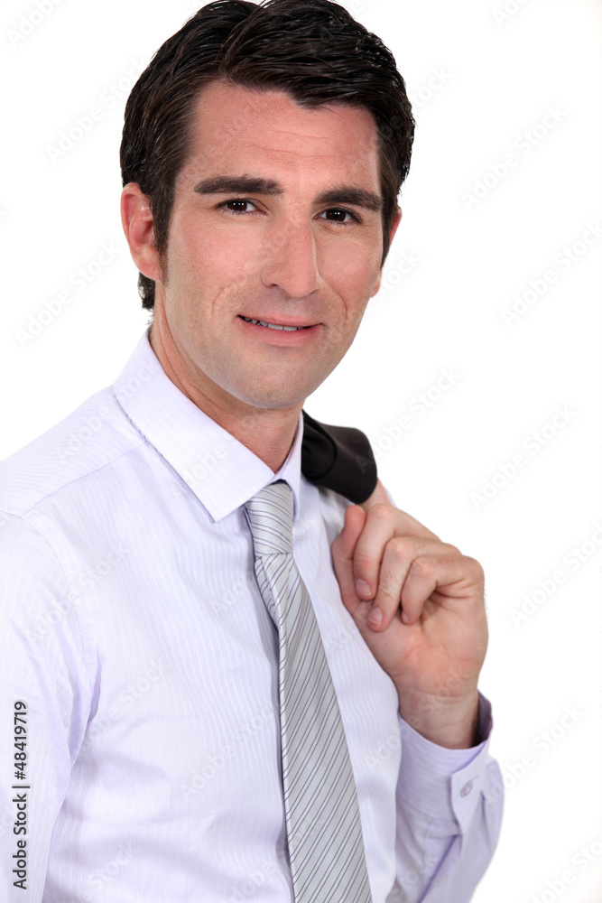 Businessman with his jacket over his shoulder Businessman with his jacket over his shoulder