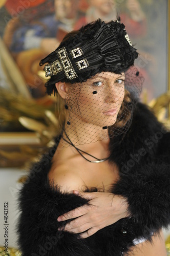 Model wearing designer hats and accessories