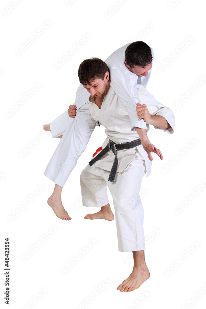 Karate. Men in a kimono with a white background.