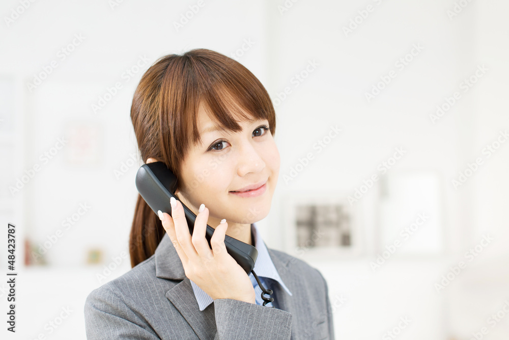 Beautiful young businesswoman working in office Beautiful young businesswoman working in office