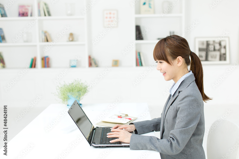 Beautiful young businesswoman working in office Beautiful young businesswoman working in office