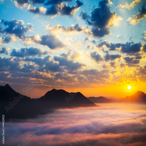 Sea of clouds on sunrise with ray lighting