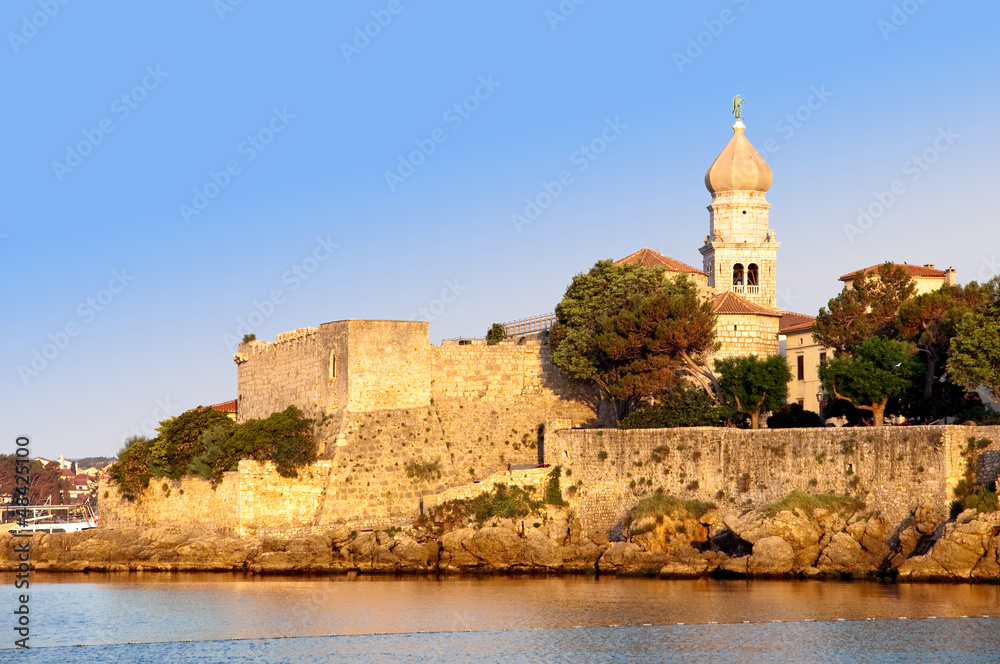 Belfry and old town walls by the sea at krk - Croatia