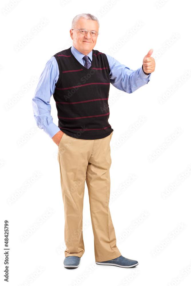 Full length portrait of a smiling mature man giving a thumb up Full length portrait of a smiling mature man giving a thumb up