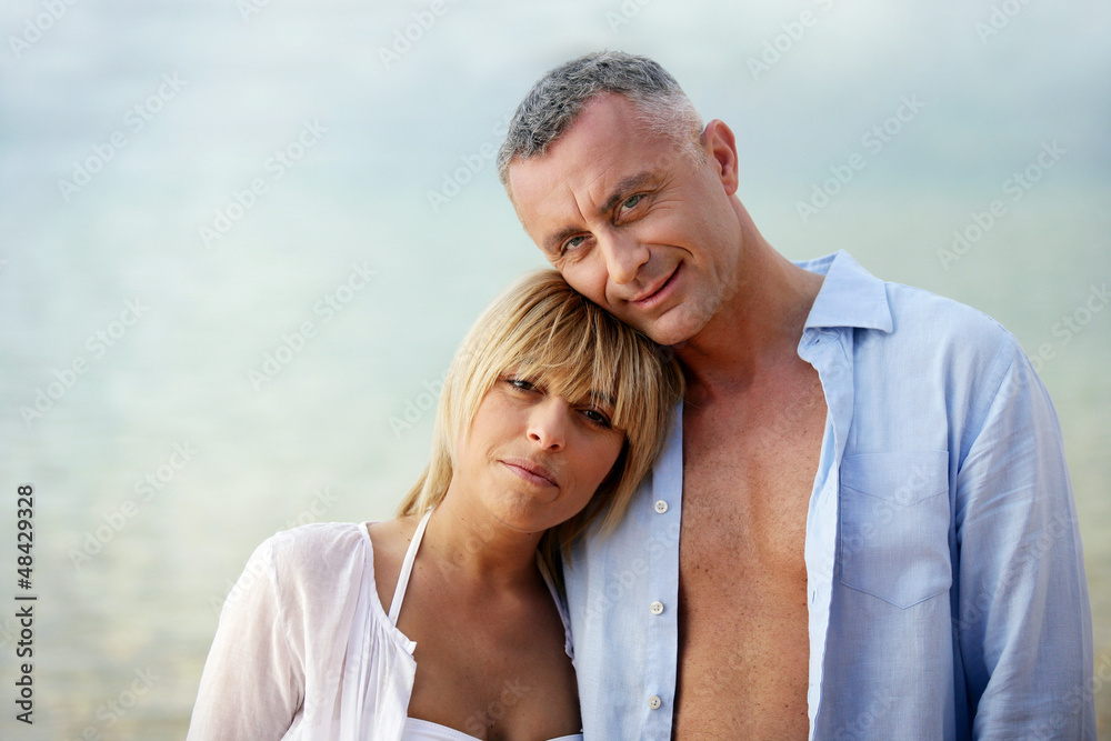 Couple wearing open shirts outdoors Couple wearing open shirts outdoors