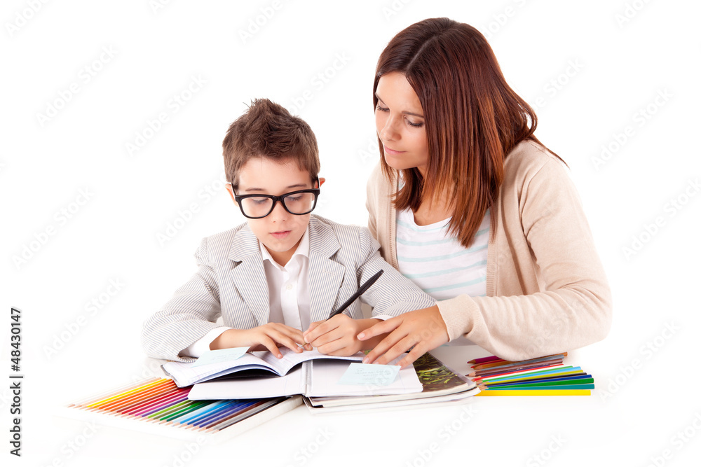 Happy woman, mother or teacher helping kid with schoolwork Happy woman, mother or teacher helping kid with schoolwork