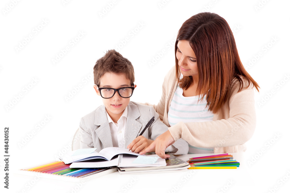 Happy woman, mother or teacher helping kid with schoolwork Happy woman, mother or teacher helping kid with schoolwork