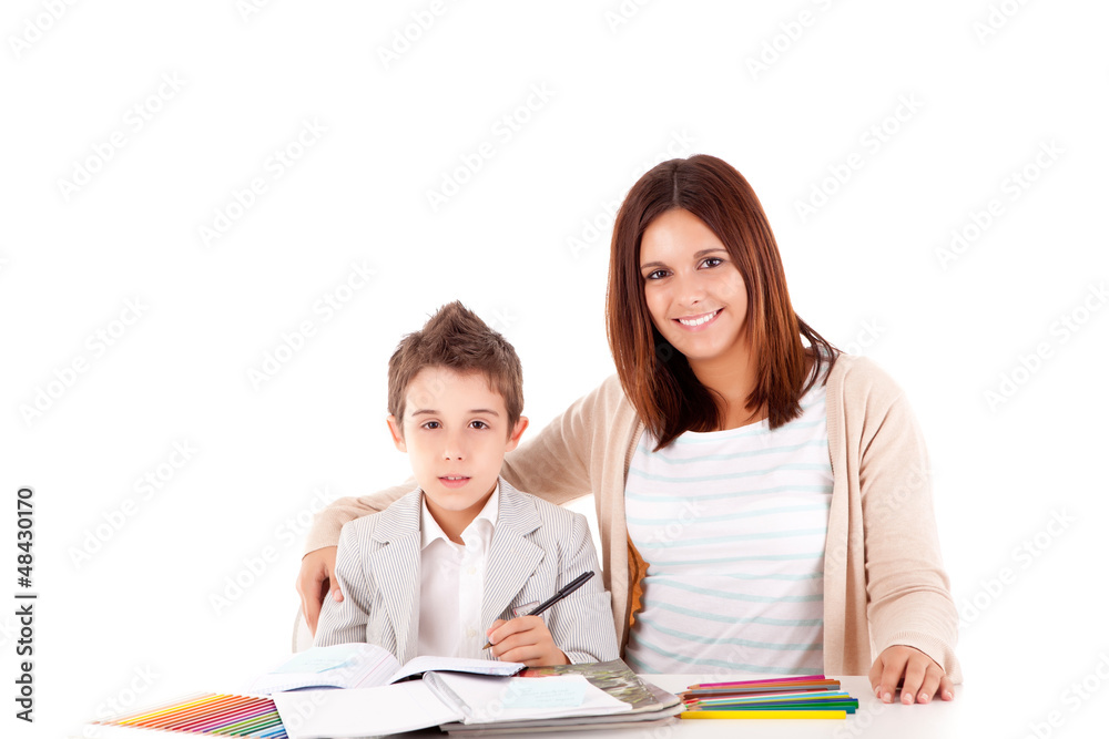 Happy woman, mother or teacher helping kid with schoolwork Happy woman, mother or teacher helping kid with schoolwork