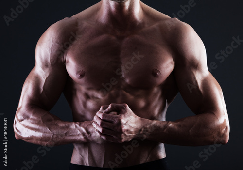 Muscular male torso with lights showing muscle detail