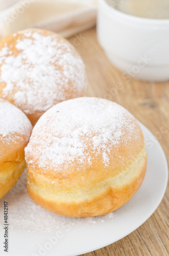 sweet donuts dusted with icing sugar closeup