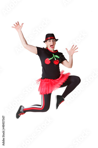 beautiful girl with hat jumping in studio