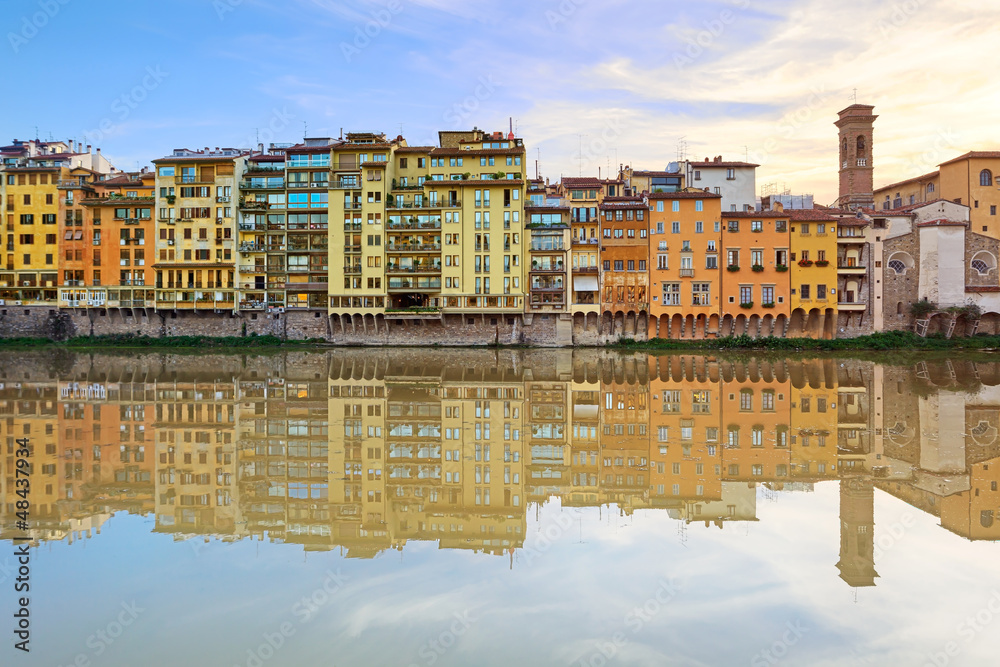 Arno river and buildings architecture on sunset. Florence