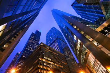 Looking up at Chicago's skyscrapers at dusk, IL, USA