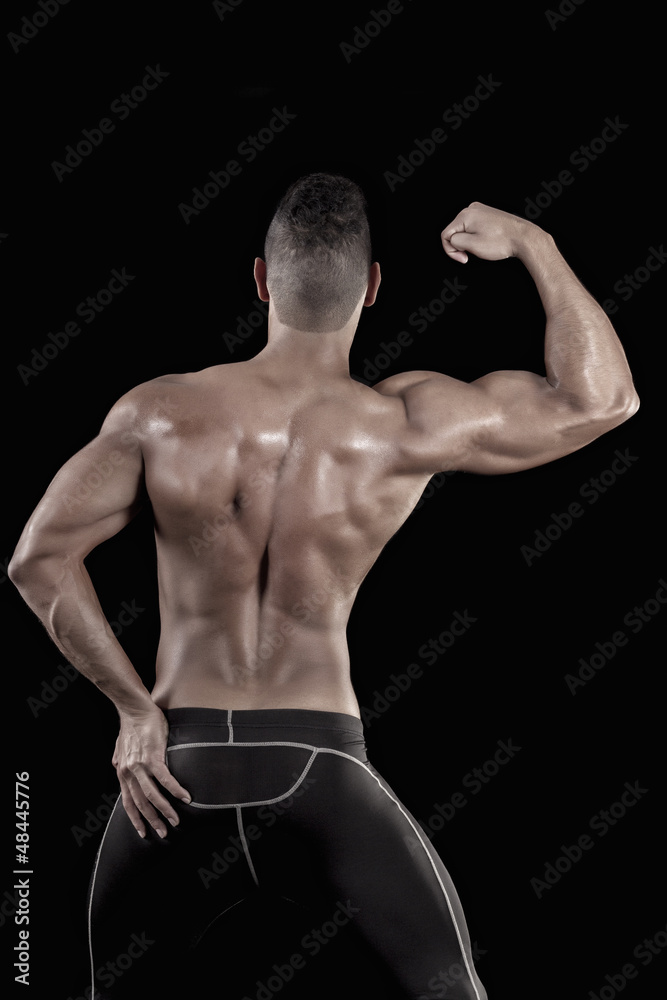 Fototapeta premium muscled man on a black background