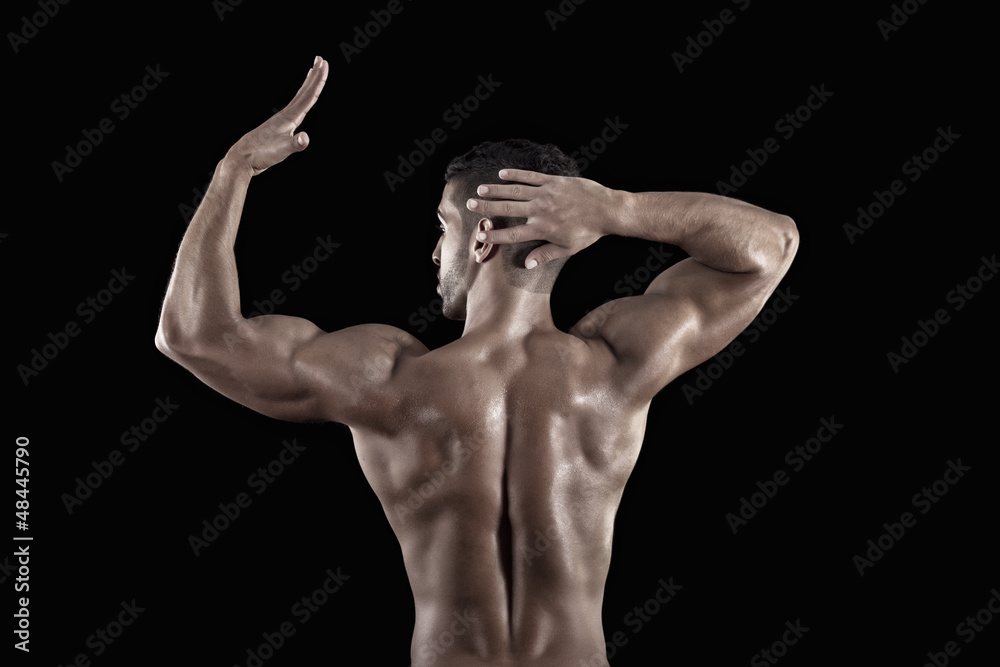 muscled man on a black background