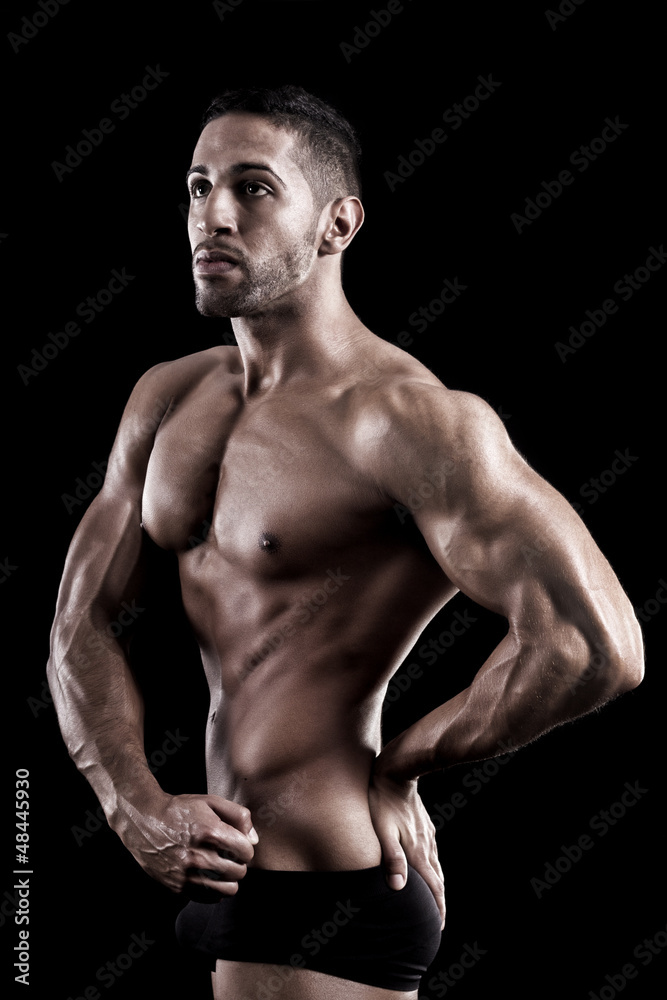 muscled man on a black background