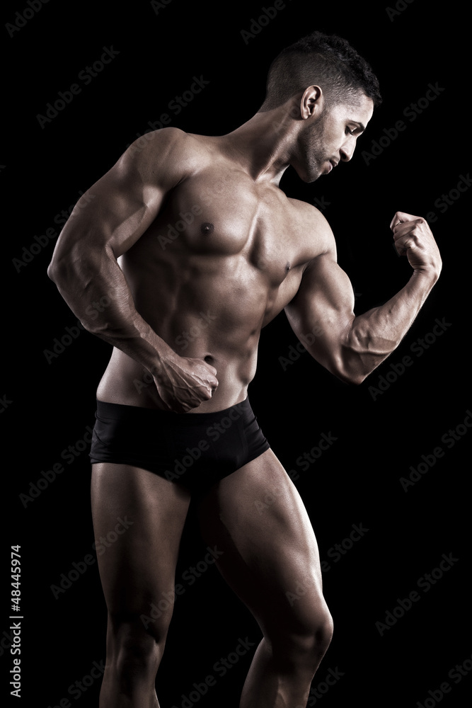 muscled man on a black background