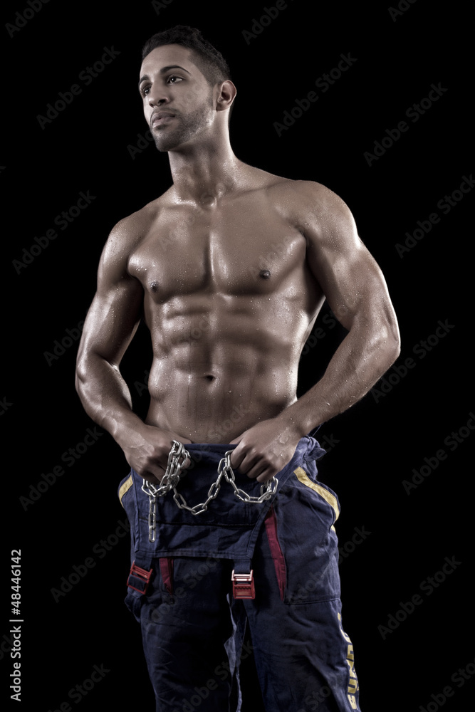 muscled man on a black background