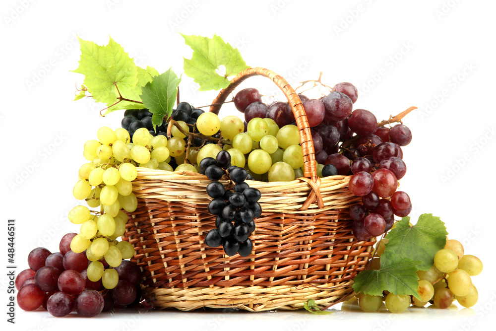 assortment of ripe sweet grapes in basket, isolated on white. assortment of ripe sweet grapes in basket, isolated on white.