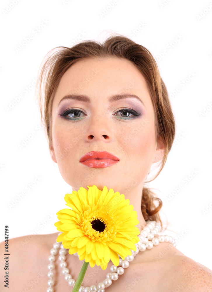 Beautiful young woman with bright make-up, holding flower,