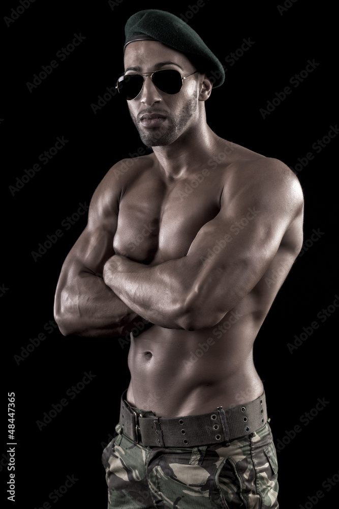 muscled man on a black background muscled man on a black background