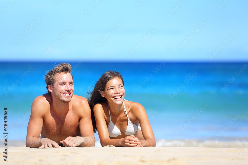 Beach couple looking Beach couple looking