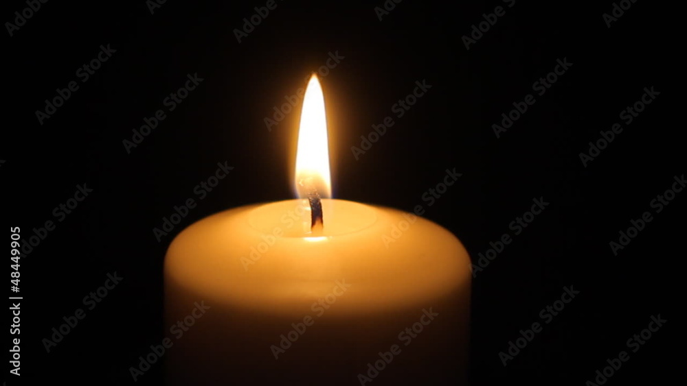 Candle in the dark with flare flame Candle in the dark with flare flame