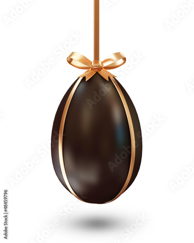 Chocolate Easter Egg with Golden Bow on white background