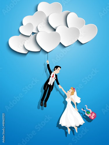 Just married couple flying with a heart shaped balloon