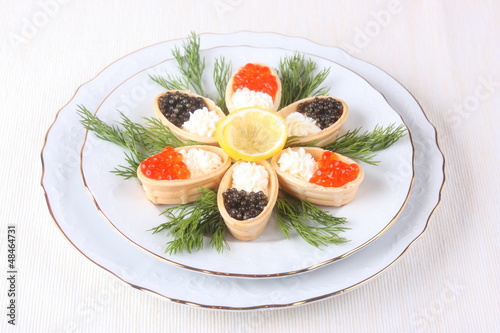 Canapes with cream cheese and caviar