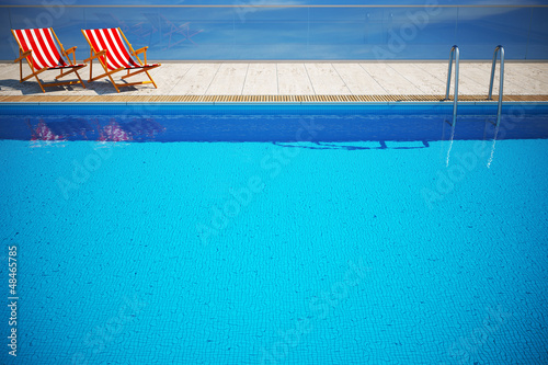 Swimming pool with beach chairs