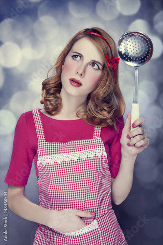 Redhead housewife with soup ladle © Masson