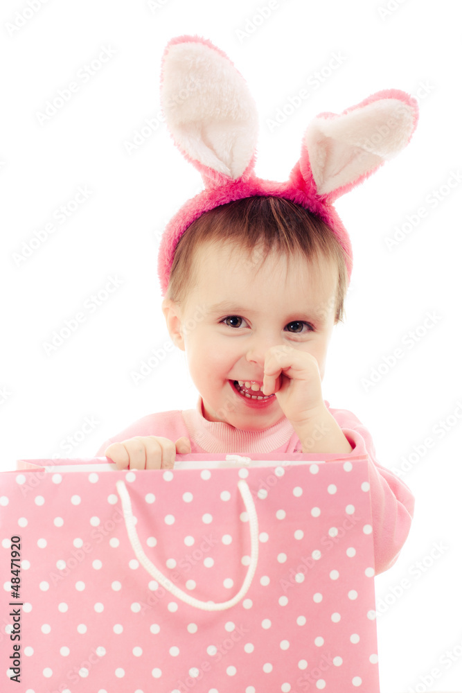 The little girl with pink ears bunny and bag. The little girl with pink ears bunny and bag.